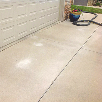 Image of a concrete driveway with a clean and new look