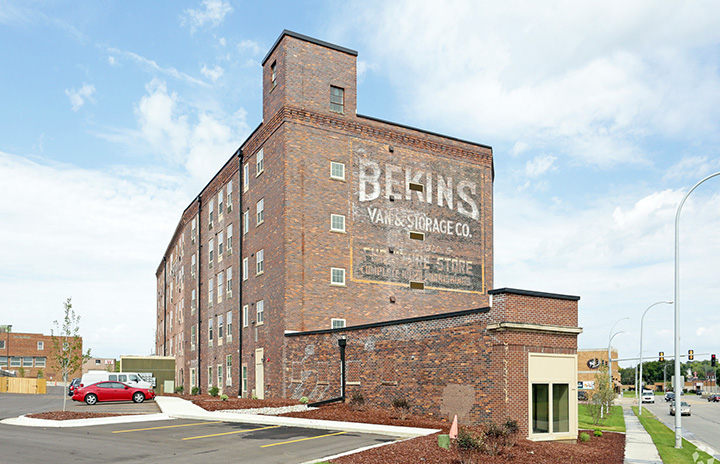 This is a front view of the Hons 5-story brick apartment building.